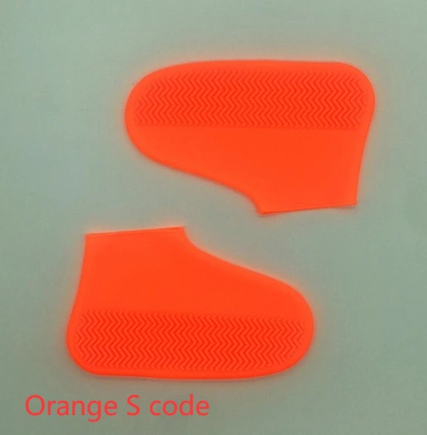 Orange silicone slip-resistant rain boot covers for hiking.