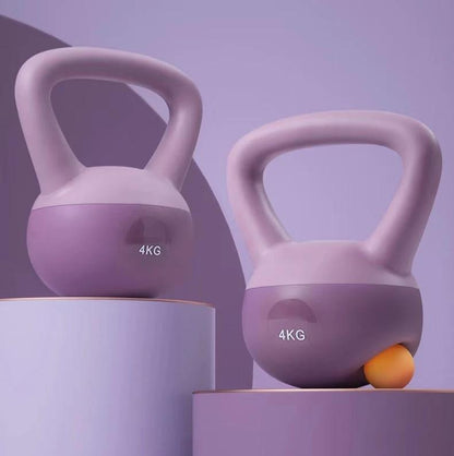 Purple 4KG PVC kettlebells for women's fitness workouts.