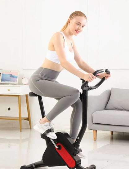 Exercise bike with webbing for safe and effective workout in a home setting.