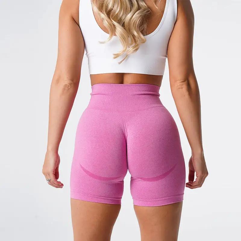 Women's pink yoga shorts fitness pants featuring a high waistband, ideal for sports and exercise activities.