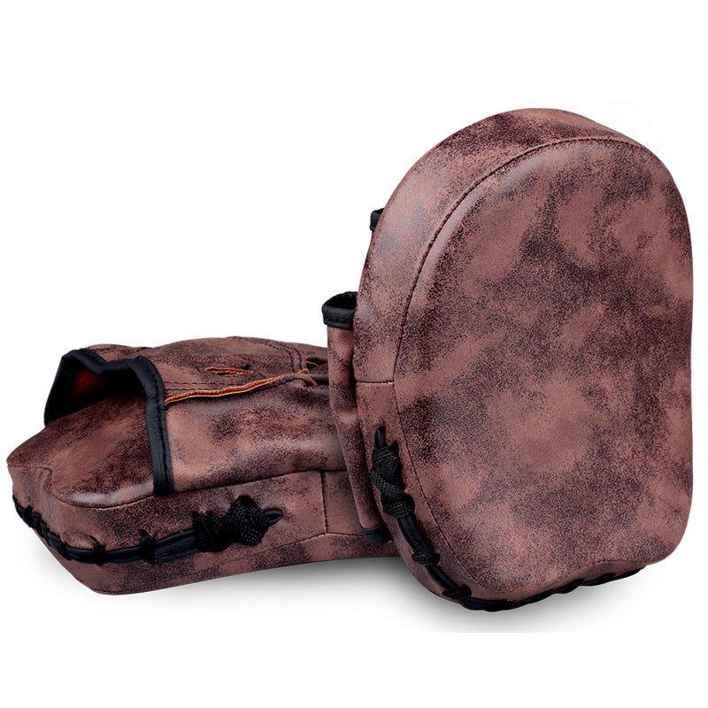 WILKYs0Muay Thai Sanda Training Target Foot Target
 Product information:


 Material: Cowhide
 
 Style: Split Finger Gloves
 
 Color: brown single, cowhide brown single
 
 Size: 10oz

 

 Packing list:
 

Fist targe