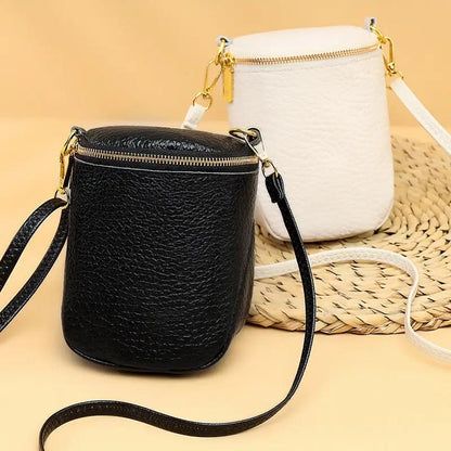 WILKYs4High-quality Leather Mobile Phone Bag Korean Style Shell Bags For Wome
 Product information:
 


 Color:black,beige
 
 Material: head layer cowhide
 
 Function:shoulder/crossbody
 
 Lining:polyester
 
 Shoulder strap: 120cm adjustable 