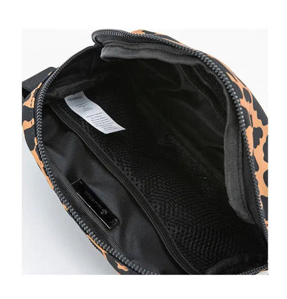 Crossbody backpack with leopard print interior, zipper opening, and concealed pocket.