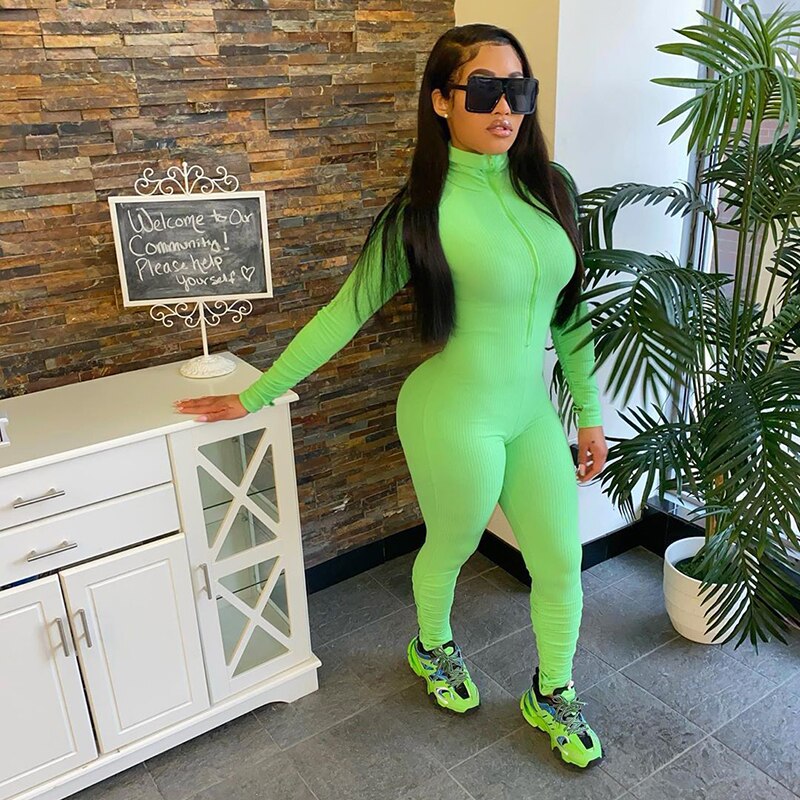 Turtleneck gloved sleeve jumpsuit leggings in green.