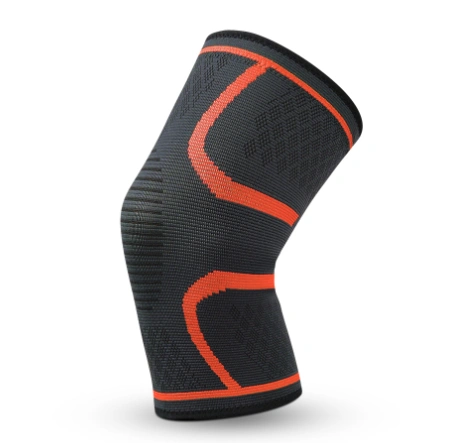 Fitness Compression Knee Pad in black and orange, designed for support and stability during workouts.